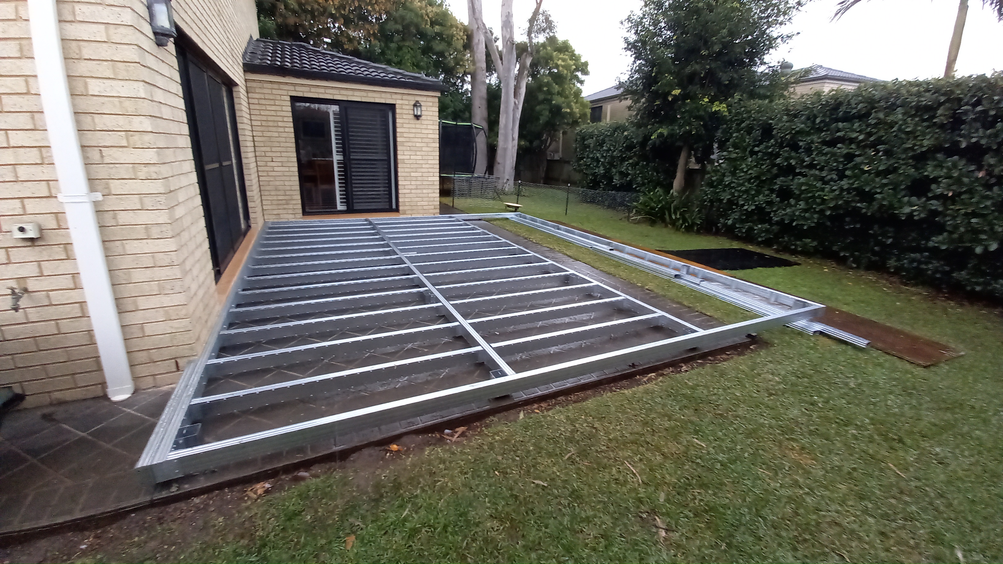 Rear of house steel frame deck on ground