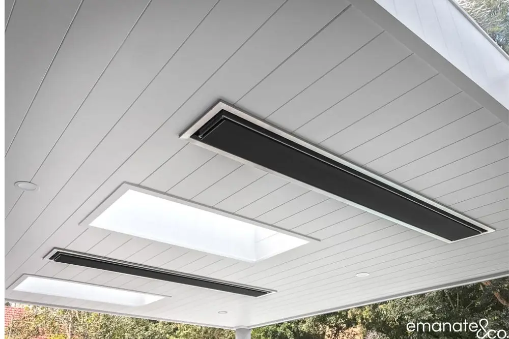 Architectural patio ceiling with twin skylights and integrated heating panels, combining natural light and thermal comfort.
