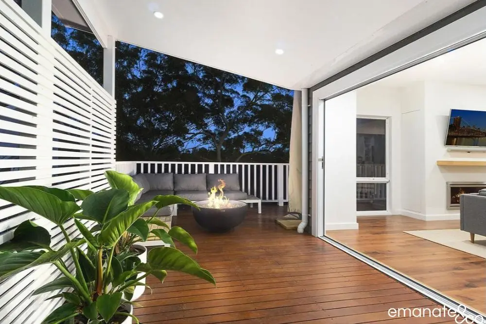 Illuminated lined patio roof and outdoor room with warm downlights at night in Normanhurst.