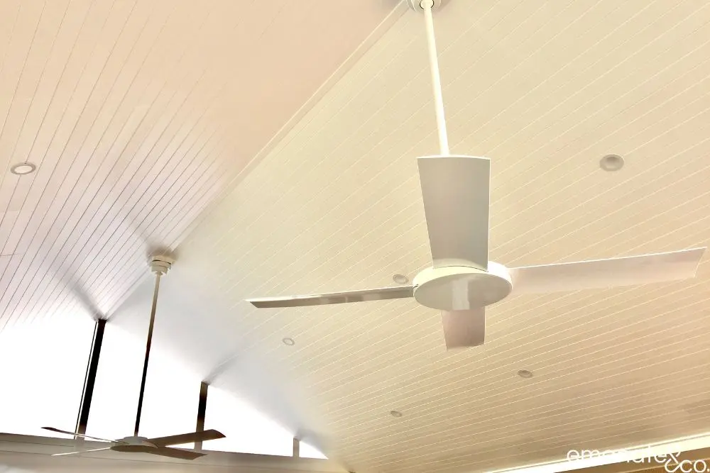 Dark timber-look lined patio roof with a white ceiling fan for a bespoke outdoor room in Turramurra.