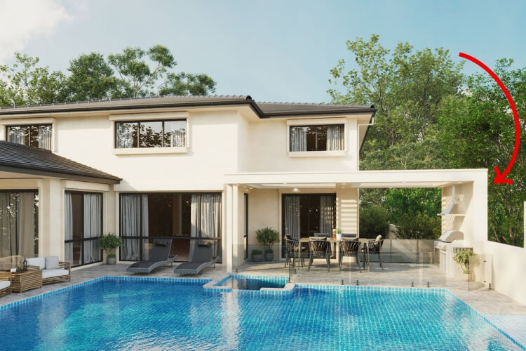 Custom architectural alfresco patio cover built to a property boundary line by Emanate and Co, featuring a luxury poolside outdoor room, dining table, and built-in barbecue area.