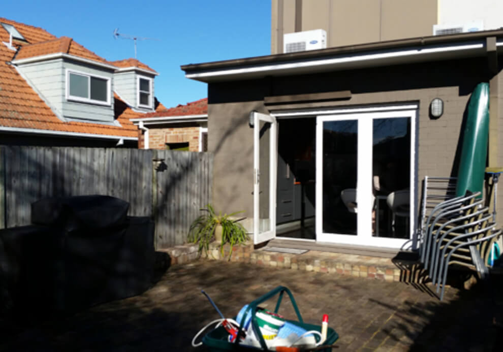 Uncovered brick courtyard and patio area on Colin St, Cammeray before renovation by Emanate and Co.
