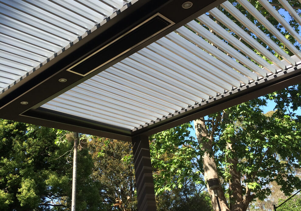 Eclipse opening louvered roof patio cover with built-in heater and recessed lighting in Lindfield by Emanate and Co.