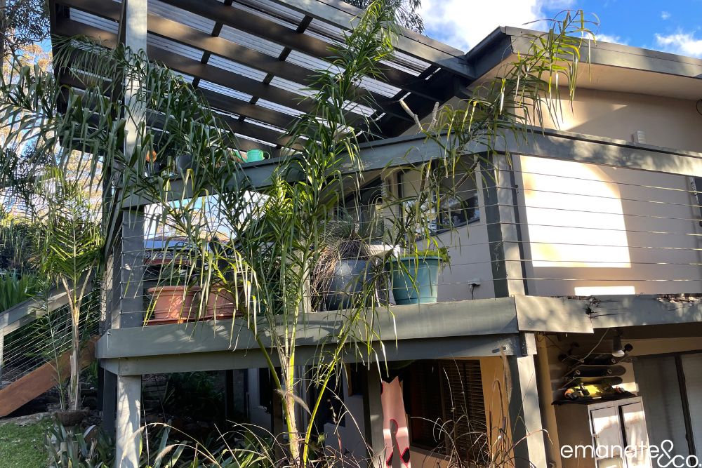 Side view of the original elevated deck and ageing patio cover before Emanate & Co. redesigned the Normanhurst outdoor space.