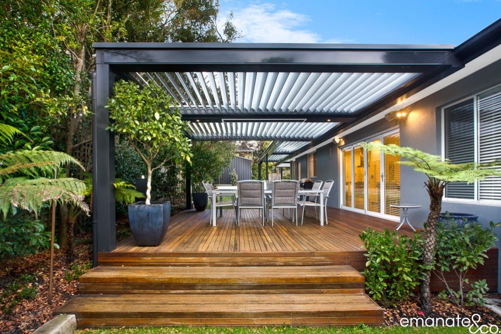 St Ives outdoor alfresco with opening louvre roof, timber decking and integrated lighting, creating a flexible space for year-round entertaining.