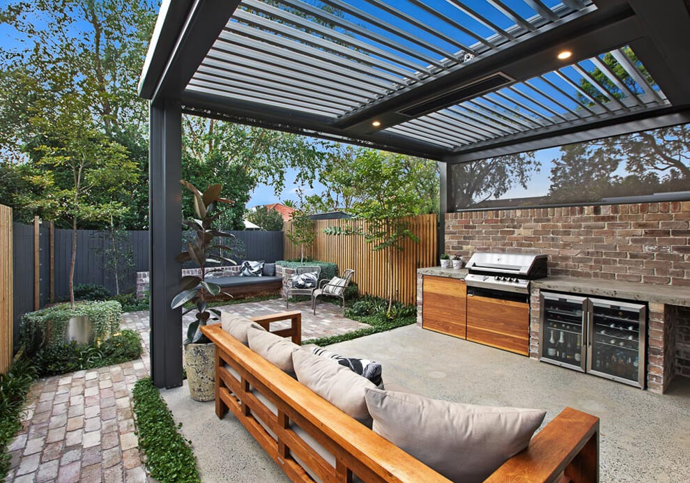 Eclipse opening louvered roof with outdoor kitchen and lounge area in Cammeray by Emanate and Co.